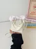 Bolsa pequena da moda e fofa para mulheres, nova versão coreana 2026, bolsa versátil, bolsa de ombro e transversal de nicho, transfronteiriça