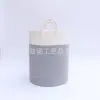 Fabricantes de fuentes originales, venta al por mayor, cesta de almacenamiento de ropa sucia con cuerda de algodón reforzada de ocho hebras, arroz gris, mapa de escena blanco, comercio exterior