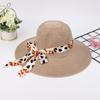 Sombrero de playa de ala ancha estilo coreano con lazo y protección solar, ideal para verano.