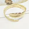 Europa y Estados Unidos cruzado metal caliente envuelto brazo anillo de oro anillo de brazo punk pluma plata moda pulsera de brazo decoración de brazo