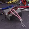 Lanyard para teléfono móvil al por mayor de fábrica, cordón para llavero de cámara de cuero PU, cuerda de muñeca para teléfono móvil de pareja, cuerda tejida de cuero
