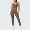 Conjunto de outfit de yoga ajustado con diseño deportivo en la espalda, de tela cepillada con bloques de color transfronterizos, sensación nude, pantalones largos de cintura alta para levantar glúteos para correr y fitness
