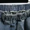 Foto real de pantalones vaqueros de pierna ancha estilo americano para mujer, adelgazantes, holgados, con caída, temporada de primavera, talla grande, tiro alto, dobladillo curvo, pantalones largos hasta el suelo
