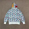 Sudadera con Capucha Doble y Estampado de Camuflaje con Letras Bordadas 'Shark', Chaqueta con Capucha Cruzada al por Mayor en Stock, Manga Larga Casual y Versátil