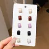 Conjunto de pendientes de perlas con lazo de color caramelo elegante estilo coreano para mujer, pendientes dulces con un diseño moderno y único