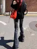 Jeans acampanados negros retro vintage americanos para mujer, nuevo estilo de primavera y otoño, con diseño de ligero deslavado y piernas acampanadas elásticas