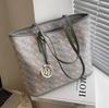 Bolsa de Textura de Alta Classe Feminina de Grande Capacidade 2023 Novo Verão All-match Bolsa de Ombro Simples Classe Commuter Tote Bag