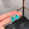 Estilo europeo y americano simulación Paraiba conjunto de joyería de collar de pendientes piedra principal del pendiente 10*12 colgante 12*16