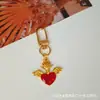 Chaveiro Estilo Gótico Transfronteiriço, Acessórios de Pingente de Metal Retrô, Asas de Coração de Pêssego, Pingente de Cruz Escura