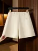 Pantalones cortos de lana para mujer otoño e invierno cintura alta holgados adelgazantes elegantes de lana línea A 2026 nuevo estilo capa base ropa exterior pantalones bootcut