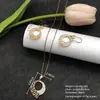 Conjunto de pendientes y collar Xuping estilo vintage de nicho europeo y americano transfronterizo, conjunto de joyería elegante de aleación de cobre, venta al por mayor y hecho a medida