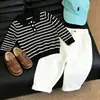 Conjunto de polo de otoño estilo coreano y pantalón largo a rayas para niños, nueva colección 2026, moderno y versátil