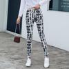 Comércio exterior atacado quente fabricantes primavera e outono finos seda de leite alta elasticidade leggings calças lisas com estampa abstrata femininas