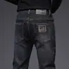 Jeans ajustados negros para hombre, pantalones largos elásticos versátiles de alta gama casual para hombre, nueva colección primavera/verano
