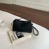 Elegante y chic bolso de mano tipo dumpling para mujer, nuevo modelo otoño e invierno 2026, patchwork de estampado de leopardo de lujo ligero para uso diario, bolso de hombro y cruzado