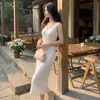 2026 Elegante Socialité Estilo Hong Kong Retro Seda de Hielo Encaje Hueco Vestido de Tirantes Dulce Picante Femenino Largo