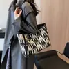 Bolso de Diseño de Nicho de Gama Alta para Mujer 2024 Nuevo Bolso de Hombro de Lona Versátil Bolso Tote Grande de Gran Capacidad para Viajar