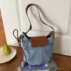 Bolsa de Ombro/Axila Feminina Versátil Elegante de Grande Capacidade Transfronteiriça Nova de Verão 2026 Bolsa Transversal Tipo Balde para o Dia a Dia