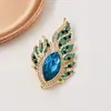 Broche requintado estilo luxo leve de alta qualidade, broche de olho de pena de anjo e fênix, acessório de terno personalizado e delicado, broche estilo europeu e americano