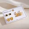 Conjunto de pendientes de mariposa con forma de anillo de metal europeo y americano personalizado con incrustaciones de diamantes florales, pendientes de botón con forma de corazón de acero inoxidable de moda transfronteriza