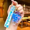 Chaveiro Pirulito Areia Movediça Luminoso Infundido com Óleo Pingente Fofo para Mochila Chaveiro Presente de Parque de Diversões Brinquedo Infantil
