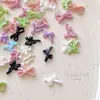 Acessórios mistos para nail art de laço cor de doce laço de fita oco broca de unha de resina decorações doces atacado