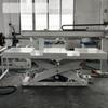 Línea de Transportador de Rodillos + Manipulador de Pórtico + Elevador de Gran Tonelaje se Combinan para Formar un Sistema para Cargar y Descargar Mercancías