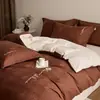 Estilo de lujo ligero juego de cuatro piezas de bordado jacquard 100% algodón puro funda nórdica de algodón de fibra larga sábana bajera ropa de cama para dormitorio principal