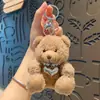 Venta especial peluche moda cool oso mochila escolar para estudiante muñeco llavero pareja linda dibujos animados pequeños regalos al por mayor