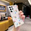 Funda de teléfono delgada y transparente estilo ballet con lazo rosa, mariposa azul y diseño floral, adecuada para Samsung S23FE/S24Ultra