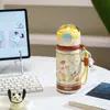 Botella de agua térmica Snoopy de acero inoxidable 316, diseñada para niñas, con un aspecto elegante, perfecta para que los estudiantes la usen en la escuela, cuenta con un asa para transportarla fácilmente y una tapa de tipo pop-up