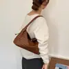 Bolso tejido artístico de estilo coreano para mujer, bolso de hombro casual simple de gran capacidad para el verano 2026, bolso para el antebrazo para el uso diario