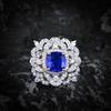 Moda retro de alta gama flor anillo azul Tan sang collar con colgante de diamante de alto carbono Princesa aretes de botón de tesoro colorido traje Europeo y Americano
