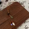 Collar de Cuerda Trenzada con Borla de Anillo de Madera Bohemio Cadena de Suéter Tejida a Mano Zen Antigua Accesorios de Nicho Personalizados