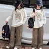 Ropa interior para niñas Otoño Manga larga 2026 Nueva camiseta Niños Estilo coreano Holgada Mediana y Grande Moda infantil Top de dibujos animados
