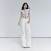 Jeans acampanados de cintura baja estilo retro americano de 4 colores para el Otoño 2026, ligeramente elásticos, versátiles, corte ajustado, jeans adelgazantes para mujer