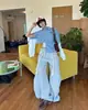 Sitio web independiente los pantalones deportivos casuales de pierna ancha de moda para mujer de primavera y otoño más vendidos, pantalones largos holgados de cordón de alta costura de moda al por mayor