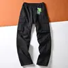 Pantalones casuales de trabajo retro estilo americano para hombre, corte holgado, diseño simple, con múltiples bolsillos, adecuados para primavera y otoño, corte recto y ajustados en el dobladillo