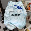 2025 Novo Outono e Inverno Estilo Nicho Vibe Moletom com Capuz Feminino Solto Street Estampa de Letras Americanas Tie-Dye Top