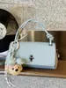 Bestseller Transfronteiriço Estilo Coreano Simples Bolsa Transversal com Pingente de Urso Feminina 2026 Nova Bolsa de Mão/Ombro de Moda de Alta Qualidade