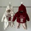 INS outono e inverno veludo dupla face bebê espessado fofo Natal Ano Novo suéter com capuz bebê masculino e feminino urso longo