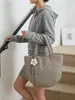 Nueva colección Otoño/Invierno 2026: Bolso de mano minimalista de color liso para mujer, bolso tote pequeño, adecuado para el trabajo y los desplazamientos, bolso acolchado de algodón estilo coreano