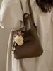 Bolso Cruzado de Hombro Único con Personalidad Casual y Sencilla, Bolso Cubo Texturizado de Moda y Tendencia, Bolso de Mujer de Nicho Primavera 2026