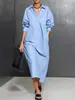 Enviado. Nuevo modelo europeo y americano de Amazon. Vestido de color liso holgado de manga larga con cuello y bolsillo