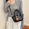 Bolso tipo cubo sencillo para ir al trabajo para mujer 2026 Nuevo modelo Bolso de mano de un solo hombro Textura de alta calidad Diseño de nicho Bolso de axila