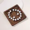 Venta Caliente Europea y Americana Lujo Ligero Alto Sentido del Diseño Perla de Imitación Hecho a Mano con Cuentas Lazo Collar Pulsera Conjunto de Dos Piezas