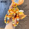 Llavero Auténtico Serie Panadería Stitch Lindo Dibujo Animado Moda Pareja Cadena para Teléfono con Cuentas Colgante para Mochila