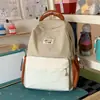 Mochila artística con bloques de color azul hielo y blanco roto, estilo coreano, para niñas, que ofrece una sensación relajada y calmante, adecuada para la escuela y los viajes