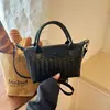 Bolso cruzado tejido de diseño de nicho nuevo 2026, bolso de mano versátil casual para mujer, estilo albóndiga