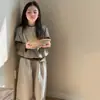 Suéter de Punto a Rayas para Niña Primavera y Otoño 2026 Nuevo Camisa Base de Manga Larga Conjunto de Tres Piezas Casual de Pantalones Anchos de Moda